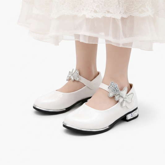 Vue latérale du mocassin ballerine fille, mettant en valeur son cuir PU lisse et souple.