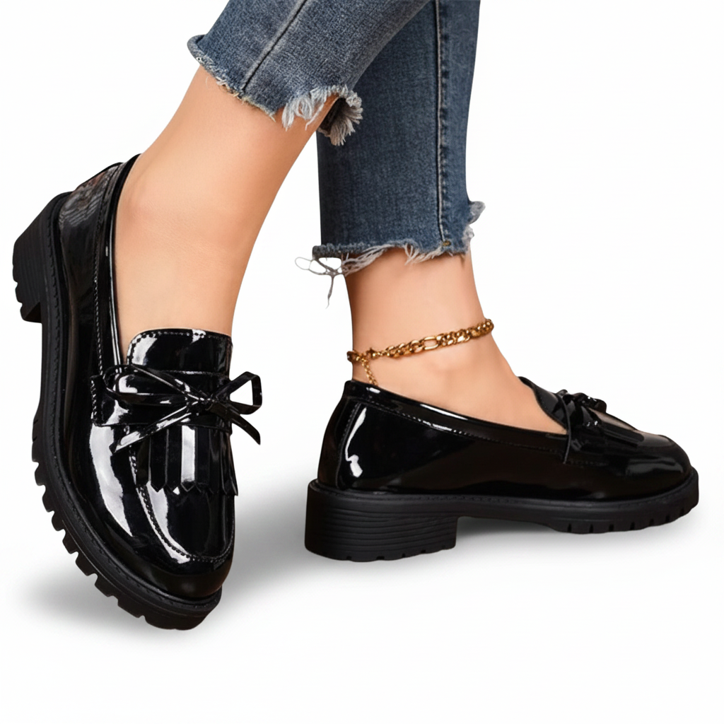 Vue latérale des mocassins plateforme en cuir véritable noir, soulignant la hauteur et le design de la semelle.