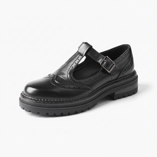 Mocassin plateforme femme en cuir vernis noir, style rétro élégant et semelle épaisse.